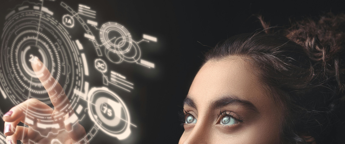 Woman looking up at and touching a holographic interface.